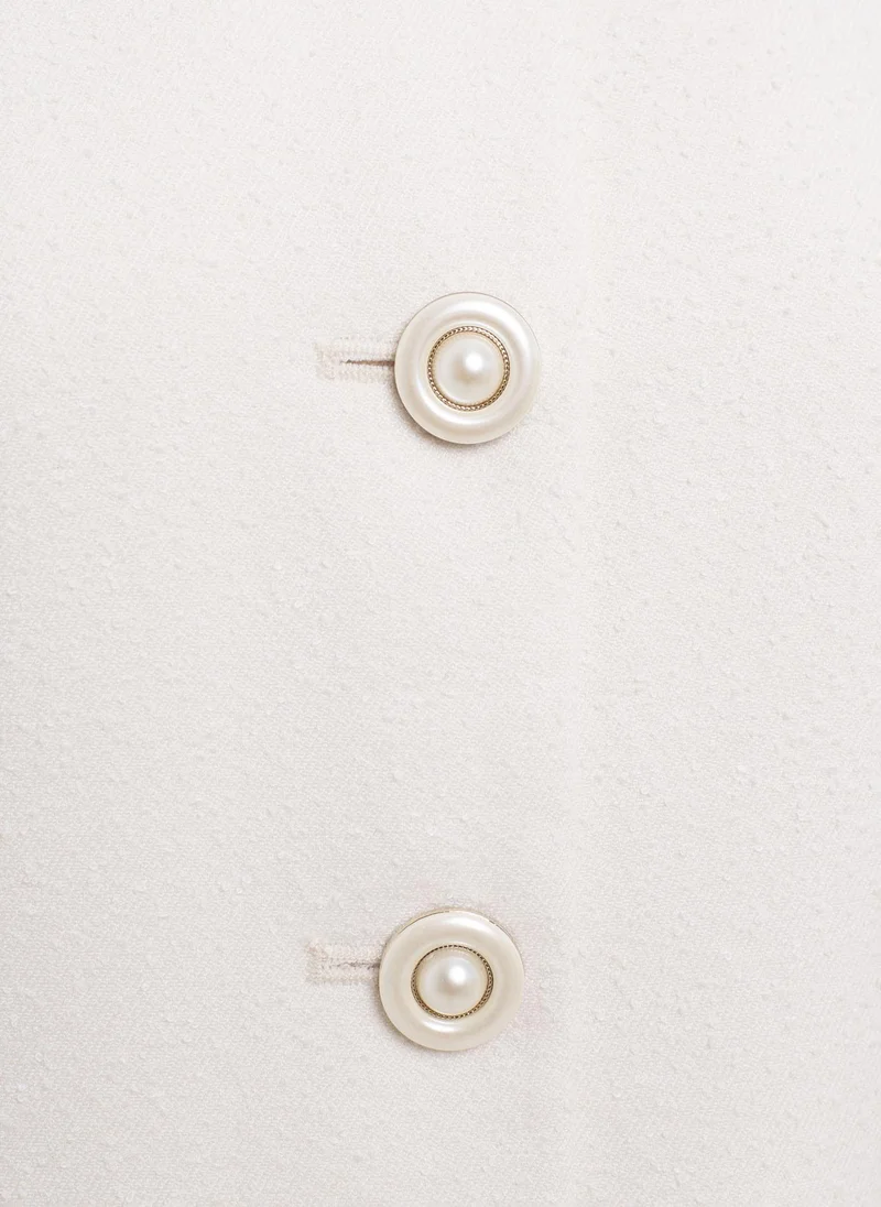 ليتشي صدرية مزودة بأزرار مميزة